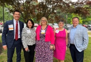 LBC alumni in group photo outside hospital